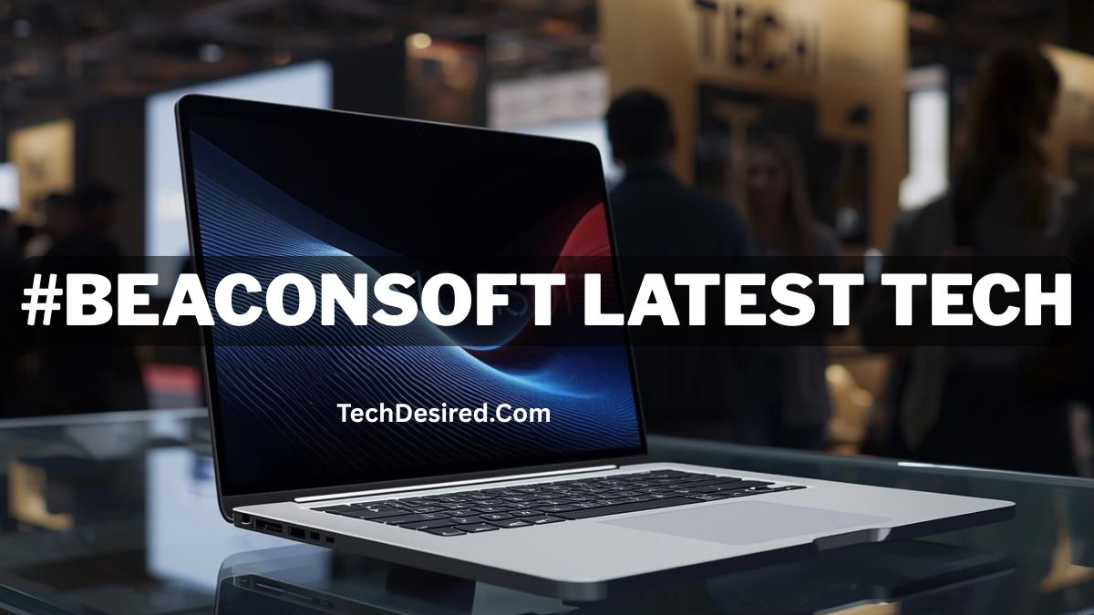 Laptop displayed on a glass table at a technology expo, with blurred attendees in the background. Bold overlay text reads “#BEACONSOFT LATEST TECH,” and smaller text below says “TechDesired.com.”